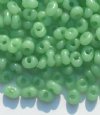 25 grams of 3x7mm Milky Green Farfalle Seed Beads